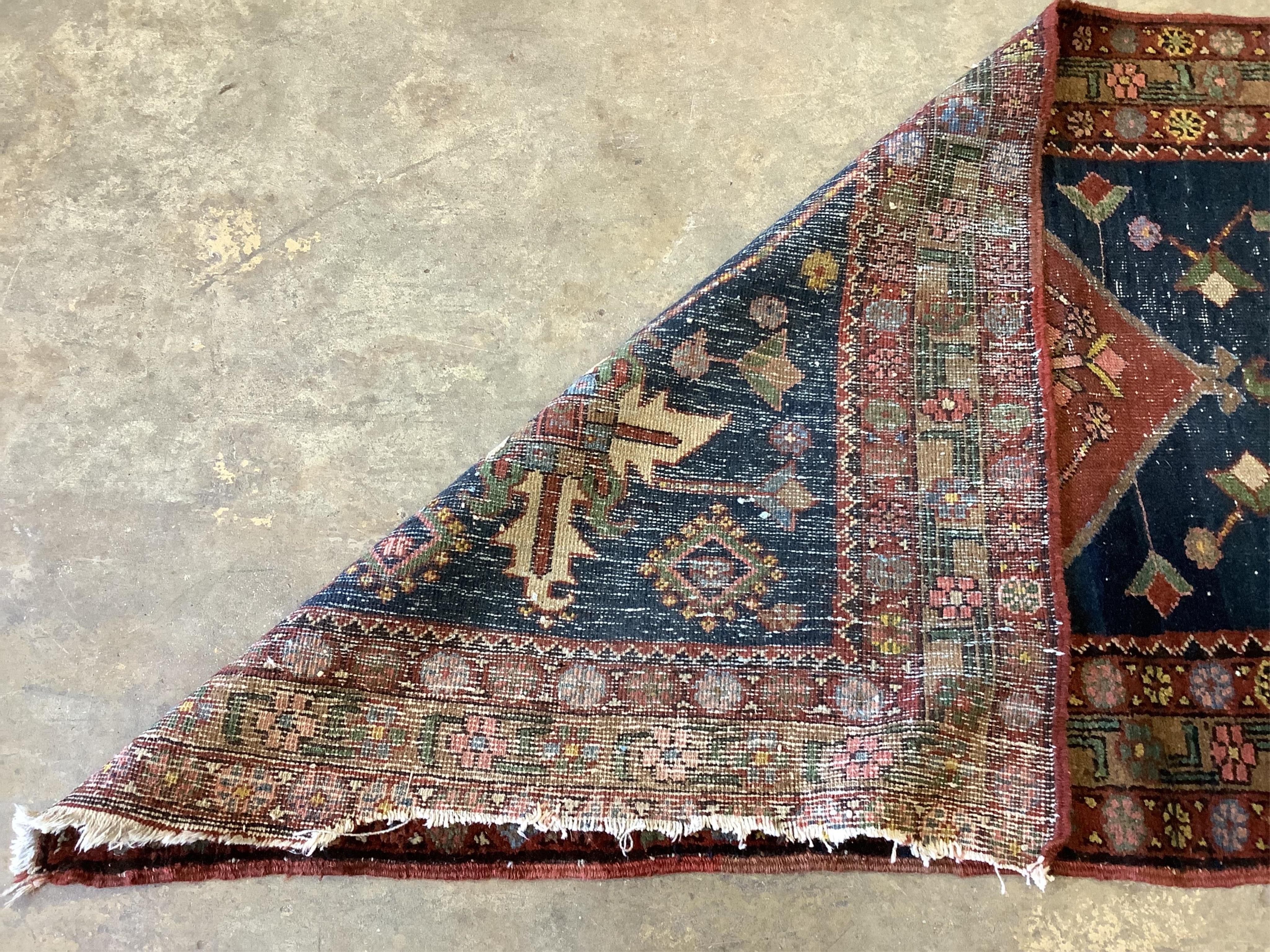 A Persian blue ground runner, 380 x 85cm. Condition - some wear and dog odour, worn at the fringes